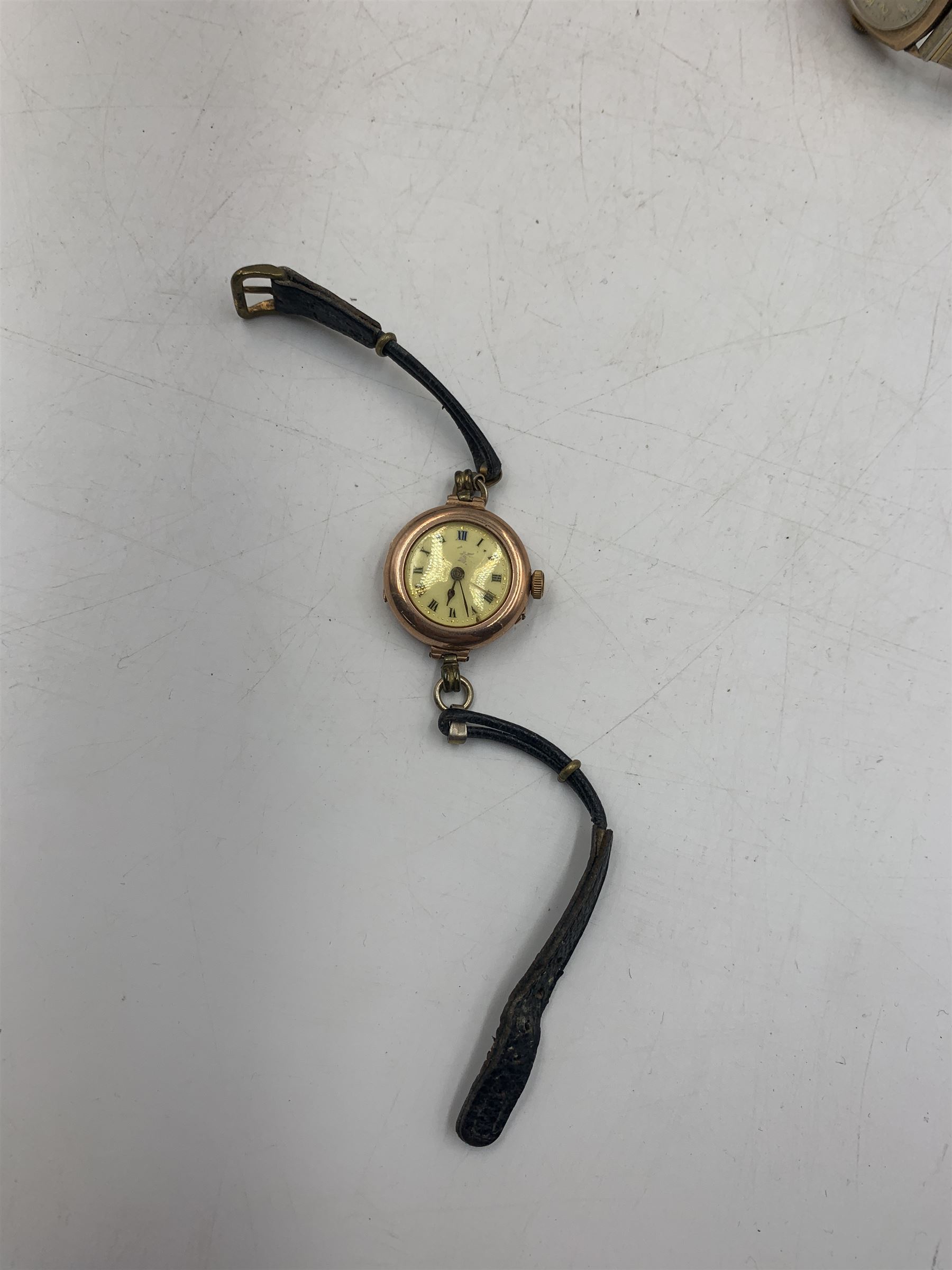 Early 20th century keyless fob watch, white enamelled dial with Roman numerals and subsidiary seconds dial, outer case stamped 14K, 9ct gold cased Rite-Tyme mechanical wristwatch, on a gilt stainless steel bracelet, a ladies 9ct gold cased mechanical movement wristwatch, with blue enameled case, on a rolled gold bracelet strap, ladies 9ct gold mechanical movement wristwatch on an expanding bracelet strap stamped 9ct and another 9ct gold cased mechanical movement wristwatch, together ladies Rotary 9ct gold cased mechanical wristwatch and ladies Bulova rolled gold mechanical wristwatch (lacking straps)