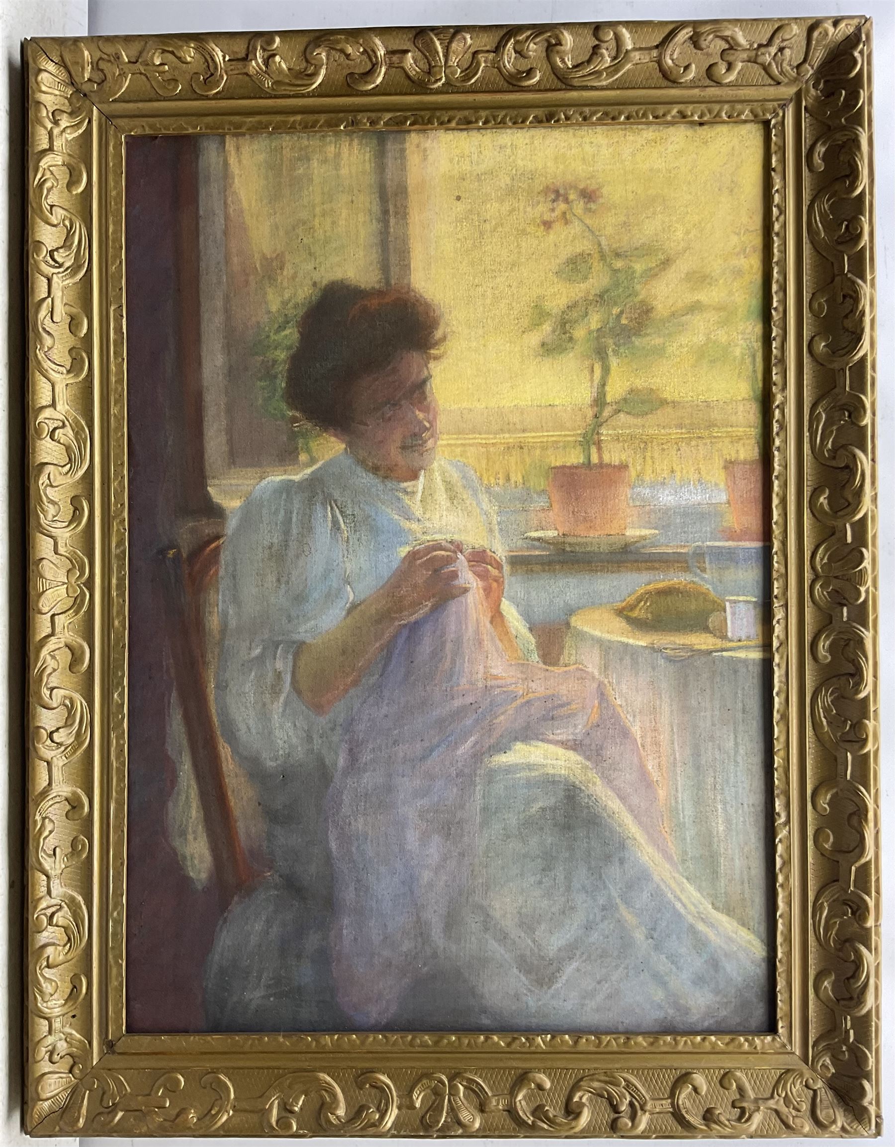 English School (Early 20th century): Lady Seated by a Window, pastel on linen canvas possibly signed lower left 91cm x 65cm