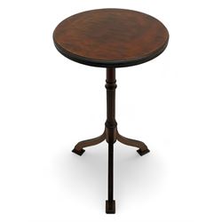 Early 20th century mahogany wine table, figured circular top with reeded edge, on turned and reed moulded stem, three reeded tapered supports on rectangular moulded pad feet 