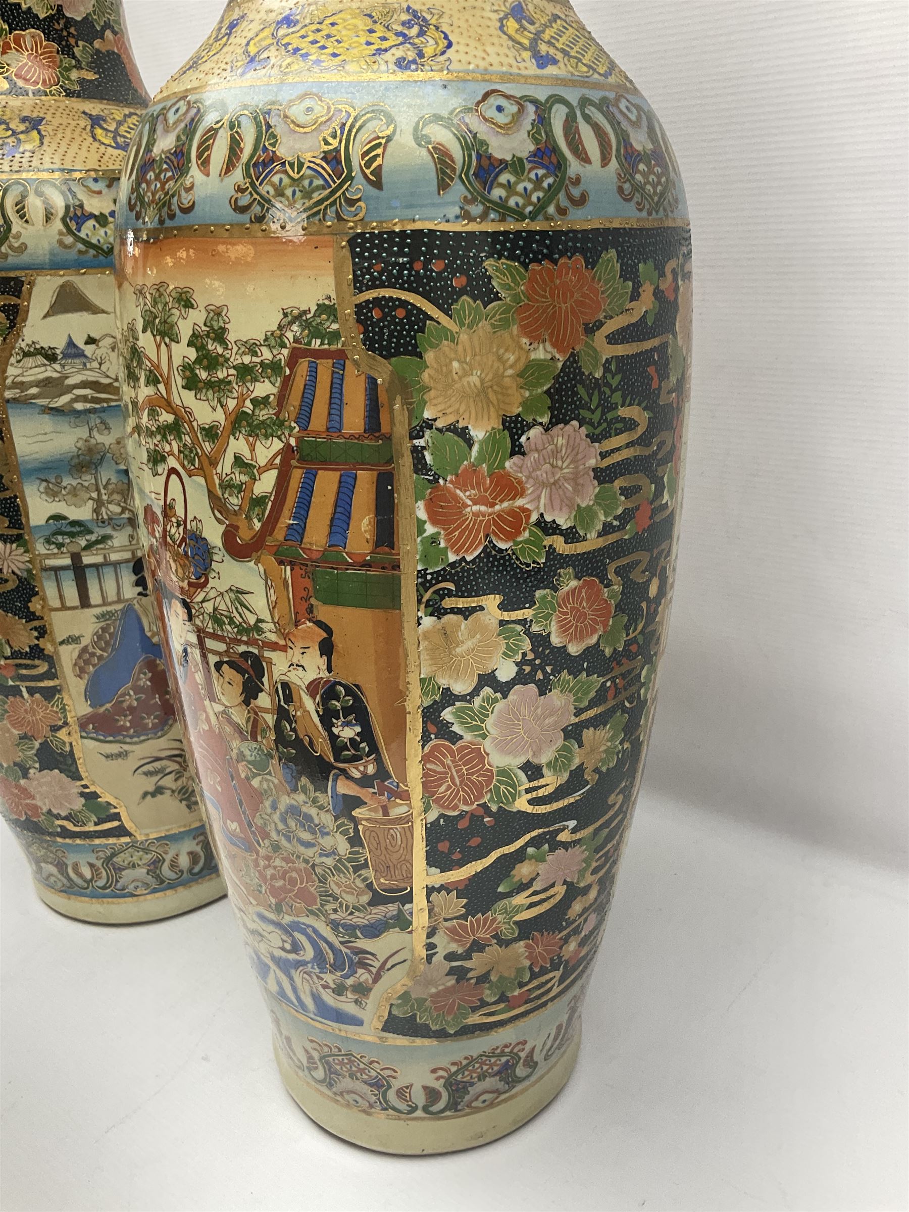 Pair of modern Satsuma vases of baluster form, decorated with figures in within river landscapes and floral borders, highlighted in gilt, H60cm