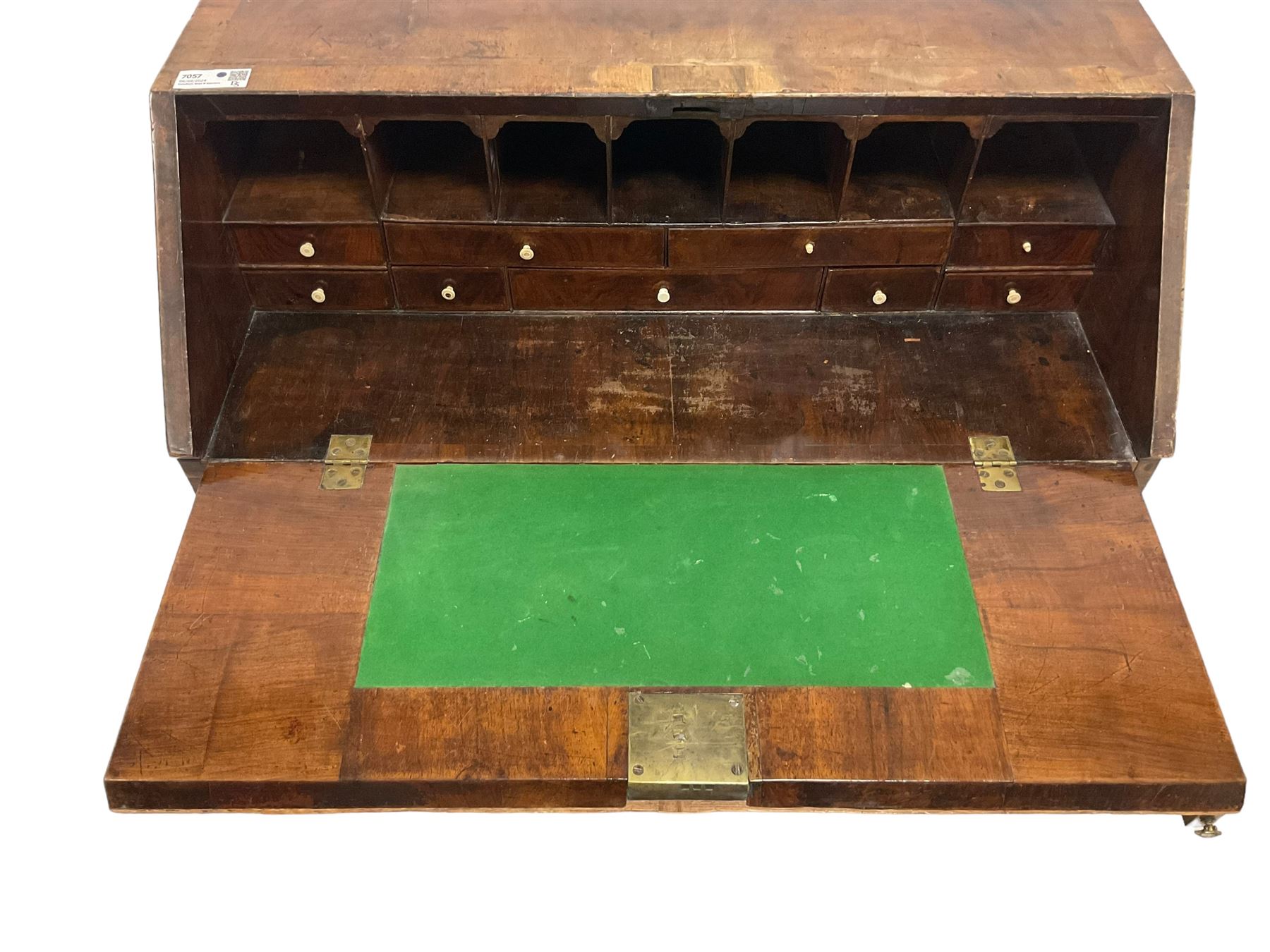 18th century walnut bureau, crossbanded and feather-banded rectangular top and fall-front, enclosing fitted interior with pigeonholes and correspondence drawers with bone handles, over two short and three long graduating drawers with moulded facias and original brass handles, on bracket feet