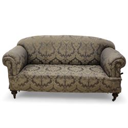 Late Victorian mahogany framed two seat drop arm sofa, upholstered in floral pattern fabric