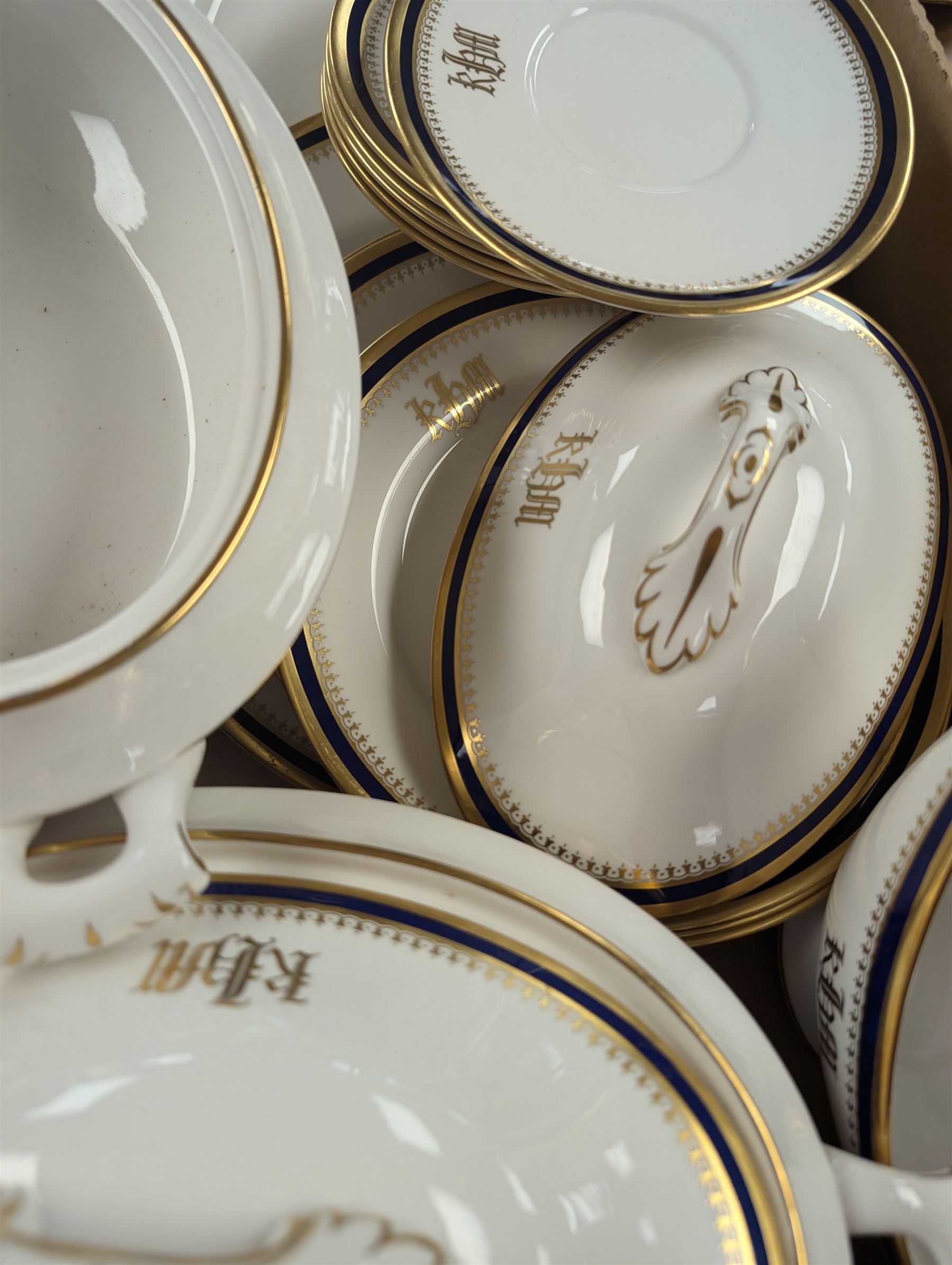 Spode Knightsbridge pattern part dinner service, comprising sauce boat, two tureens, serving platter, dinner plates, side plates and dessert plates, specially commissioned with gilt initials to each piece, with printed mark beneath