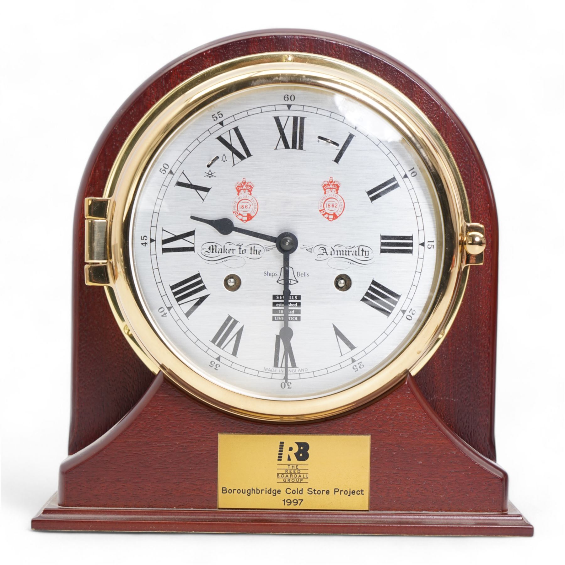 Sewills mahogany and brass cased ships type clock, with brass presentation plaque inscribed 'Boroughbridge Cold Store Project 1997', H24cm, Clevedon aneroid barometer, L57cm (2)