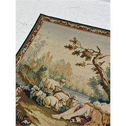 Large French machine woven tapestry, depicting figures in a landscape with a floral boarder 