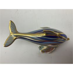 Three Royal Crown Derby paperweights, comprising Bottlenose Dolphin, Baby Bottlenose Dolphin and Striped Dolphin, all with gold stoppers 