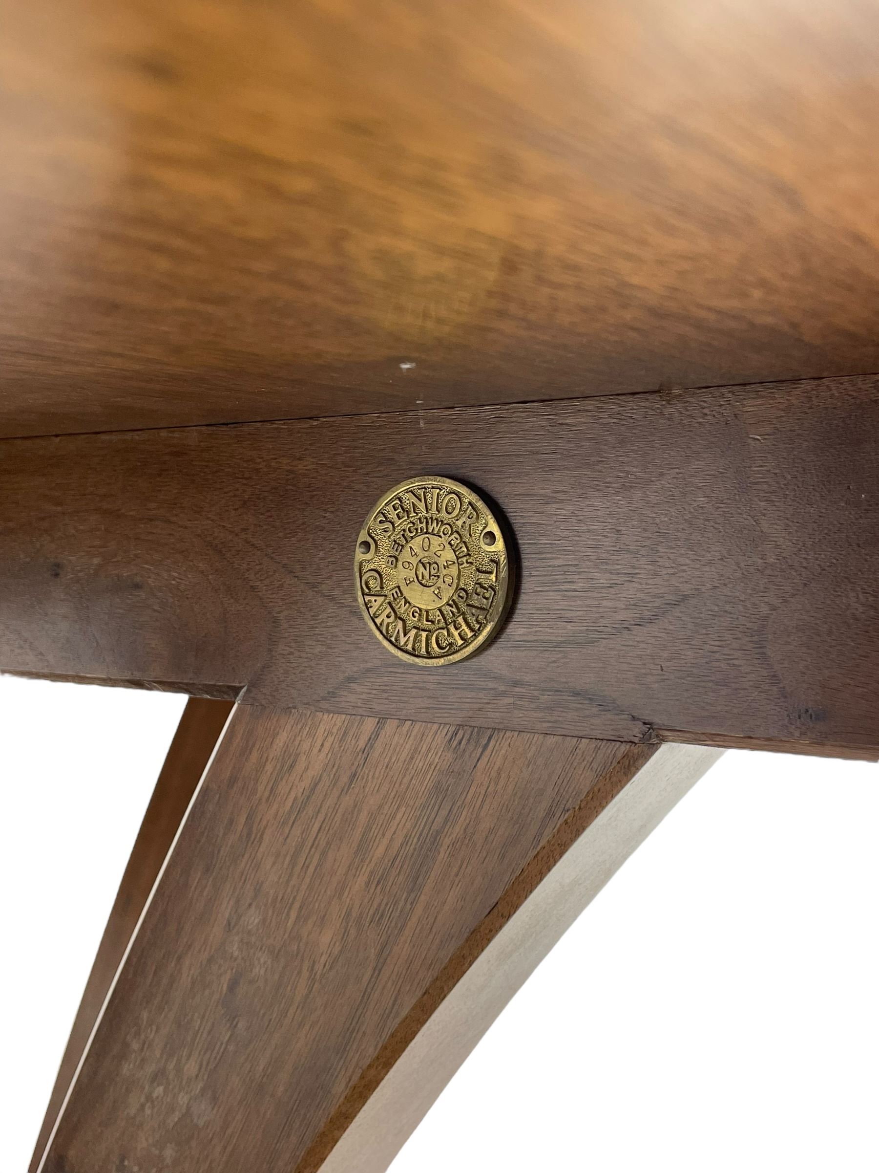 Senior & Carmichael, Betchworth - Georgian design walnut centre table, the circular moulded top with satinwood band and central star inlay, quadriform base with central orb and applied makers plaque, raised on splayed supports