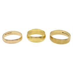 18ct gold wedding band and two 9ct gold wedding bands, all hallmarked