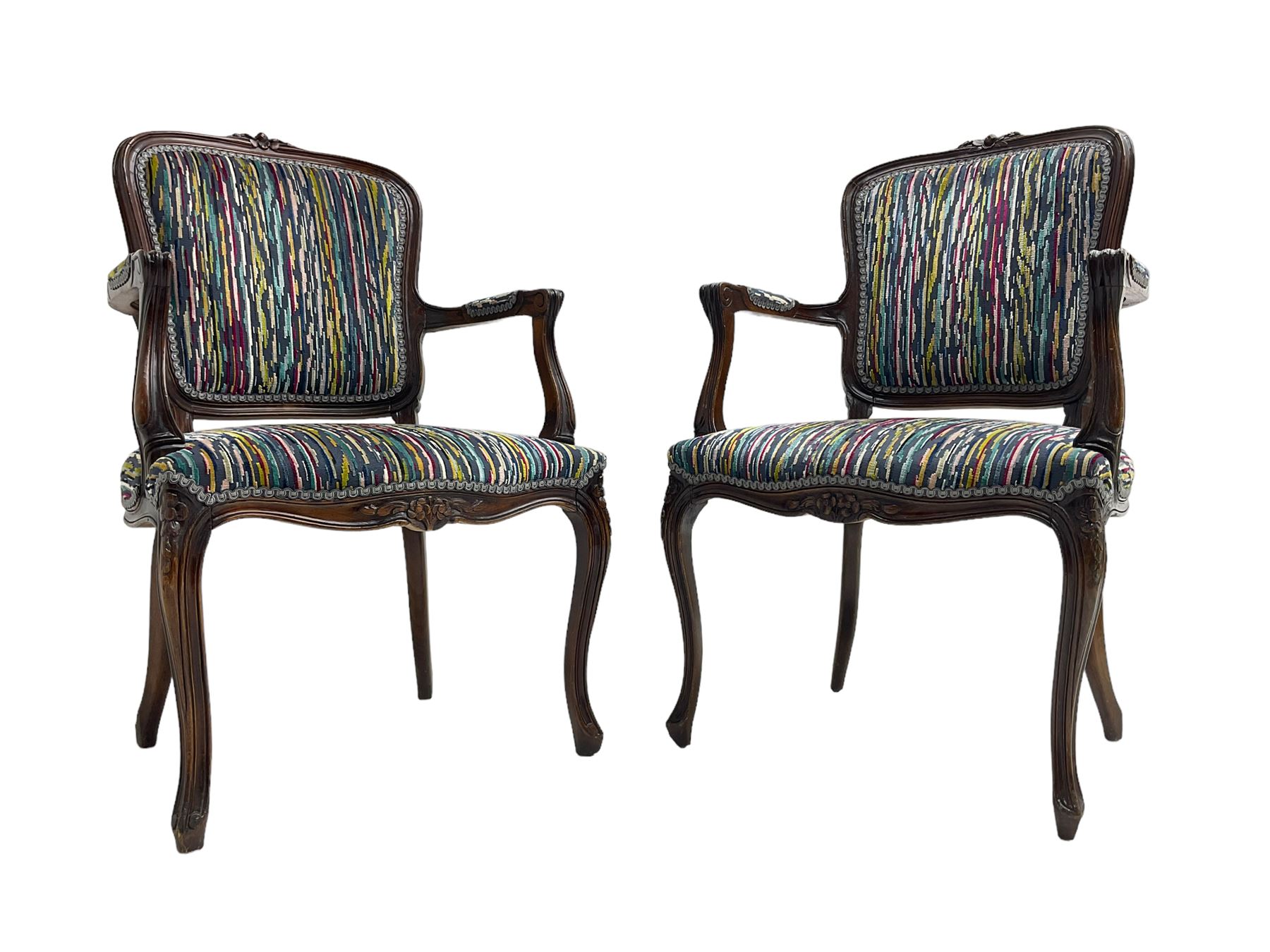 Pair of French design open armchairs, the moulded frame carved with flower heads, upholstered seat, back and arms, on cabriole supports