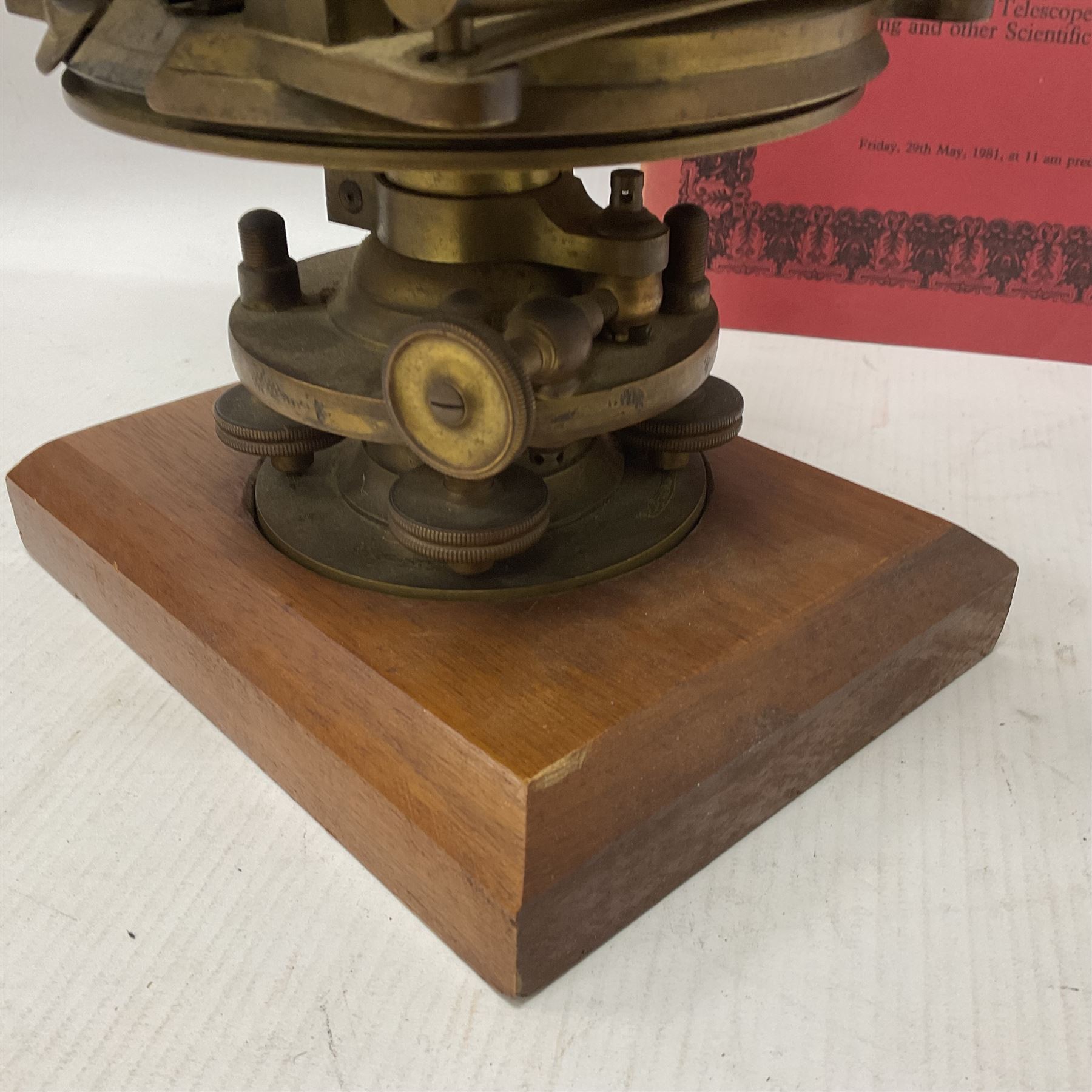 19th century brass transit theodolite by Troughton & Simms, the sighting telescope with rack and pinion focusing, above an inset compass, upon four levelling feet and a rectangular wooden base, including base H35.5cm