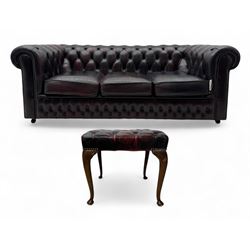 Chesterfield three-seat sofa, traditional shaped upholstered in deeply buttoned dark red l...