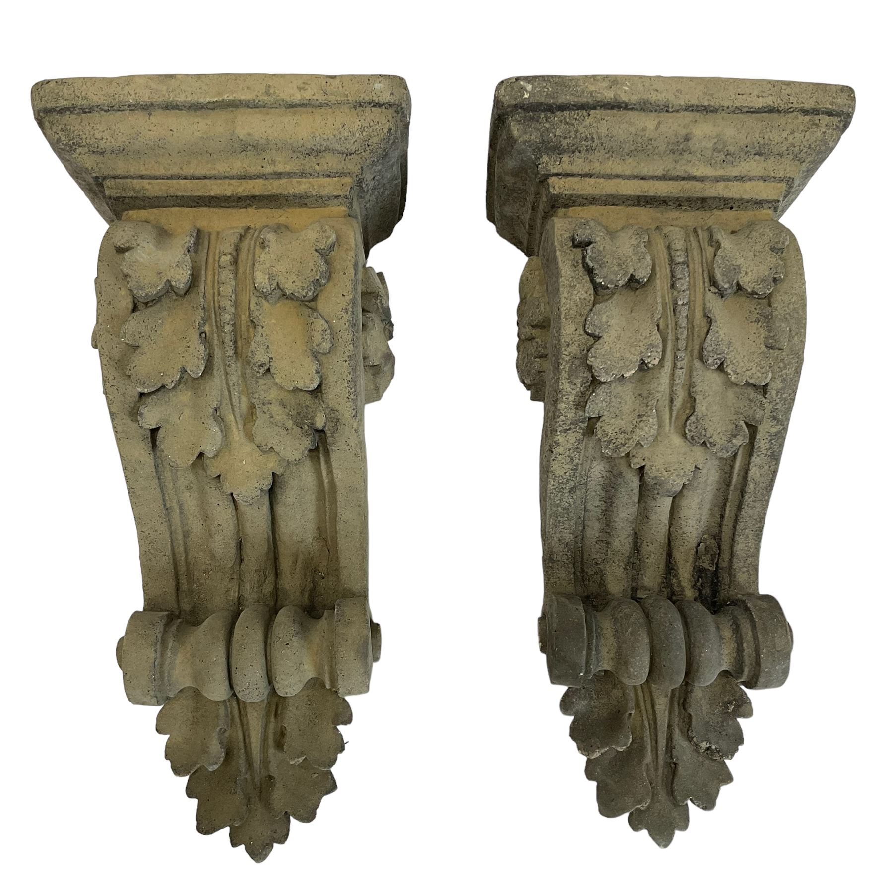 Pair of Victorian design cast stone architectural corbel wall brackets, stepped rectangular top over a scrolled bracket with relief acanthus leaf decoration and rosette motifs to the side