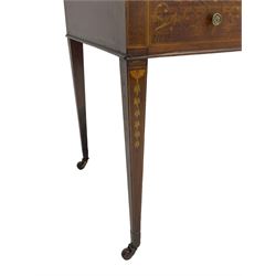 Edwardian inlaid mahogany writing desk, raised galleried back over inlaid central urn with scrolling leafy branches and six small drawers, satinwood banded rectangular moulded top with tooled leather inset, fitted with five drawers, the drawer facias inlaid with scrolling foliage and satinwood banding, square tapering supports inlaid with trailing bell flowers, on brass and ceramic castors 