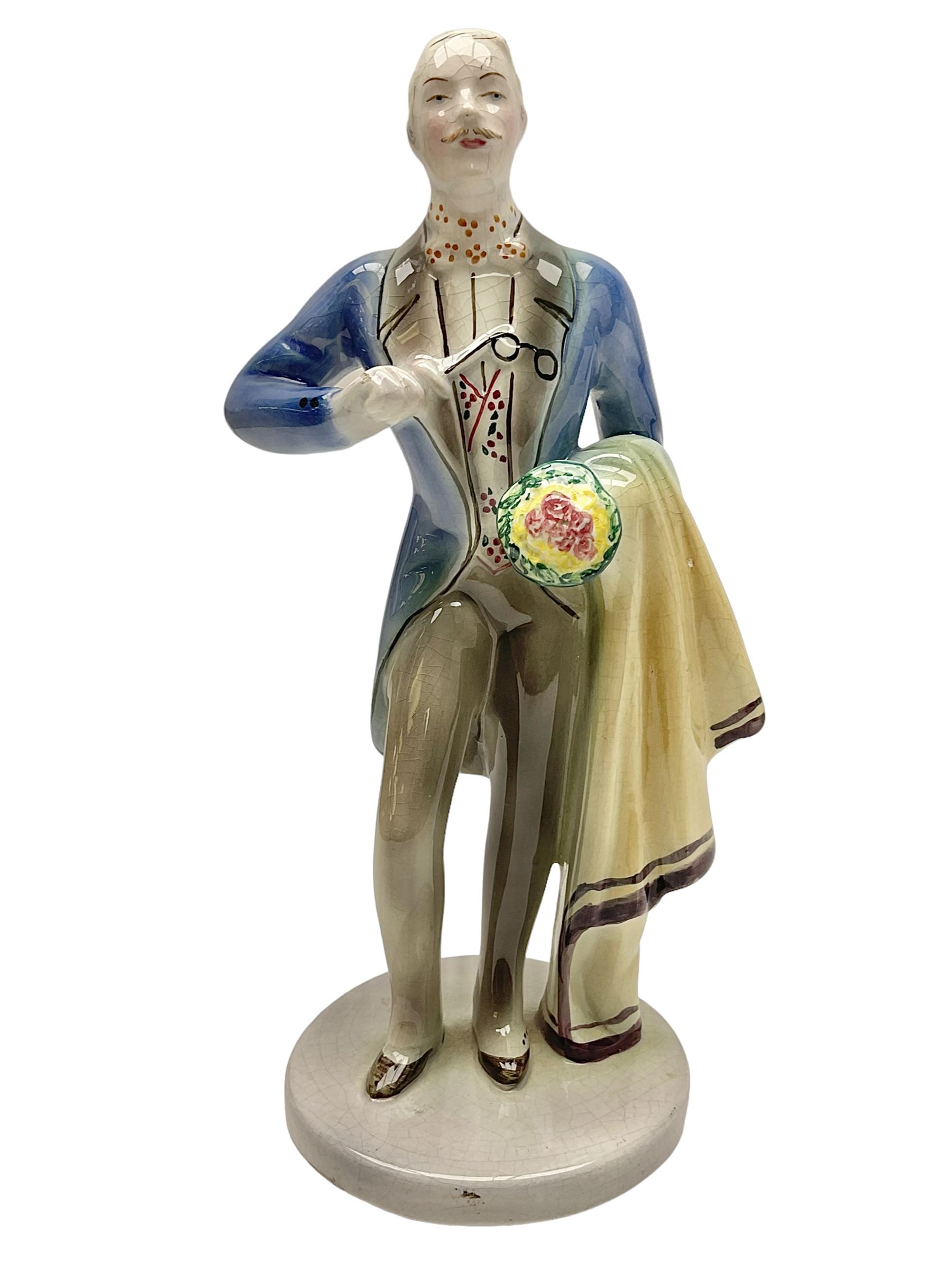 Goldscheider figure, modeled as a gentleman with flowers, upon a circular base, with printed mark beneath, H25cm