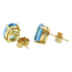 Pair of 18ct gold oval cut Swiss blue topaz stud earrings, stamped 750, total topaz weight approx 5.85 carat