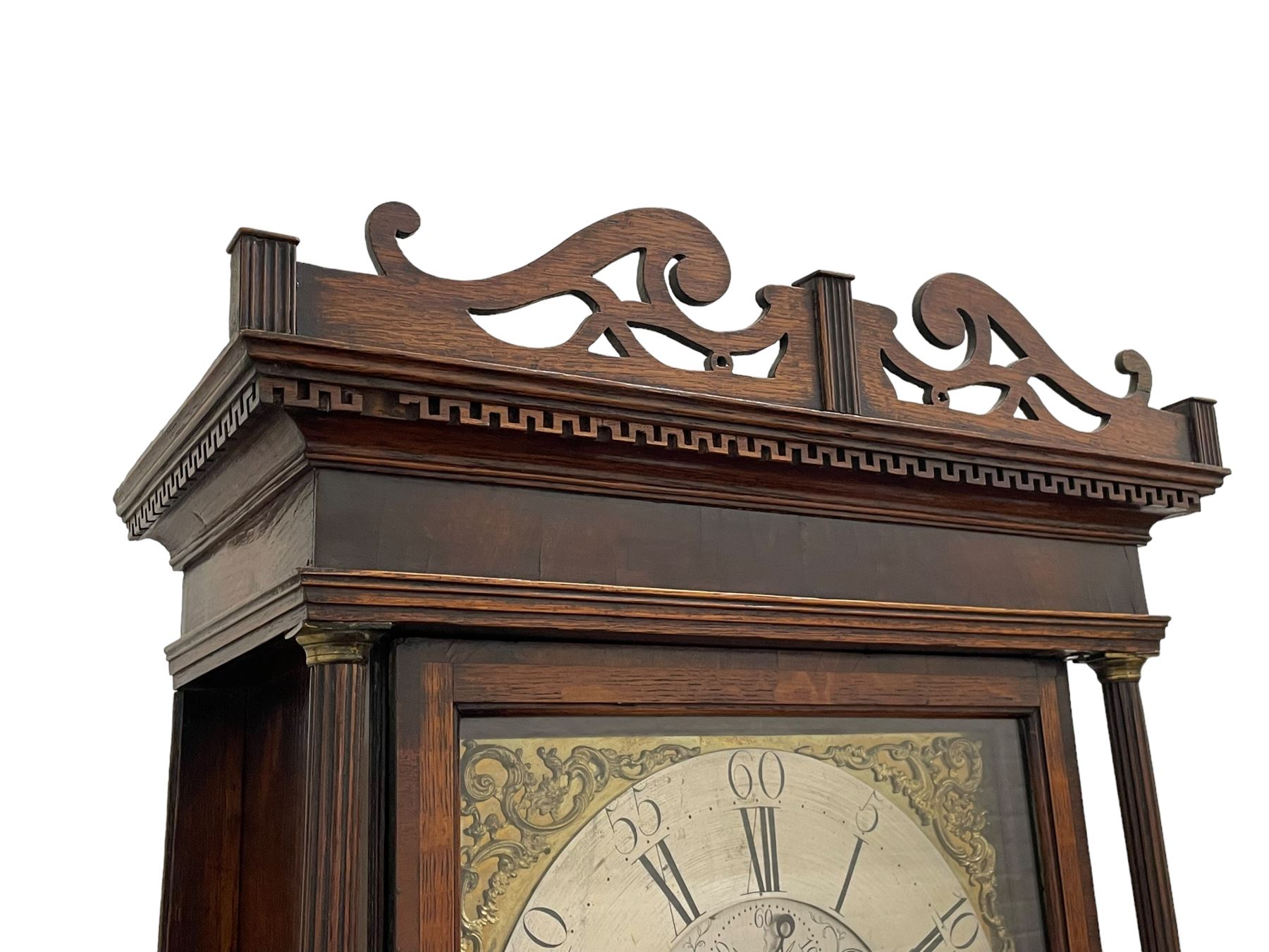 William Watson of  Blackburn (Lancs)  - late 18th century 8-day oak and mahogany cross banded longcase clock, with a flat top and open fretwork above, deep cornice with dogtooth moulding and frieze beneath, square hood door flanked by reeded pilasters with brass capitals, trunk with  reeded quarter columns, long trunk door with concave corners on a plinth with canted corners on bracket feet, brass dial with cast brass spandrels, broad silvered chapter ring with Roman numerals and five-minute Arabic's, a profusely engraved and silvered dial centre with seconds dial, matching steel hands and calendar aperture, hourly rack striking movement with a recoil anchor escapement. With weights, pendulum and key. 
William Watson of Northgate, Blackburn, is recorded as working c1770-1814 . As with this clock he frequently signed some of his clocks without a placename.