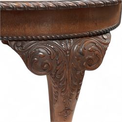 Early 20th century telescopic extending dining table, gardroon carved rectangular top with rounded ends, scrolled acanthus leaf carved cabriole supports with ball and claw feet, on brass castors, with two additional leaves  