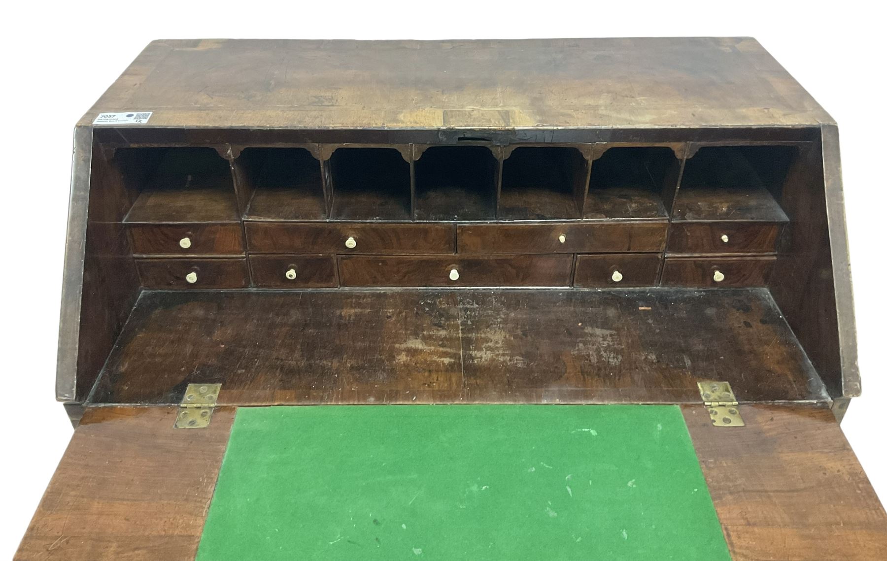 18th century walnut bureau, crossbanded and feather-banded rectangular top and fall-front, enclosing fitted interior with pigeonholes and correspondence drawers with bone handles, over two short and three long graduating drawers with moulded facias and original brass handles, on bracket feet