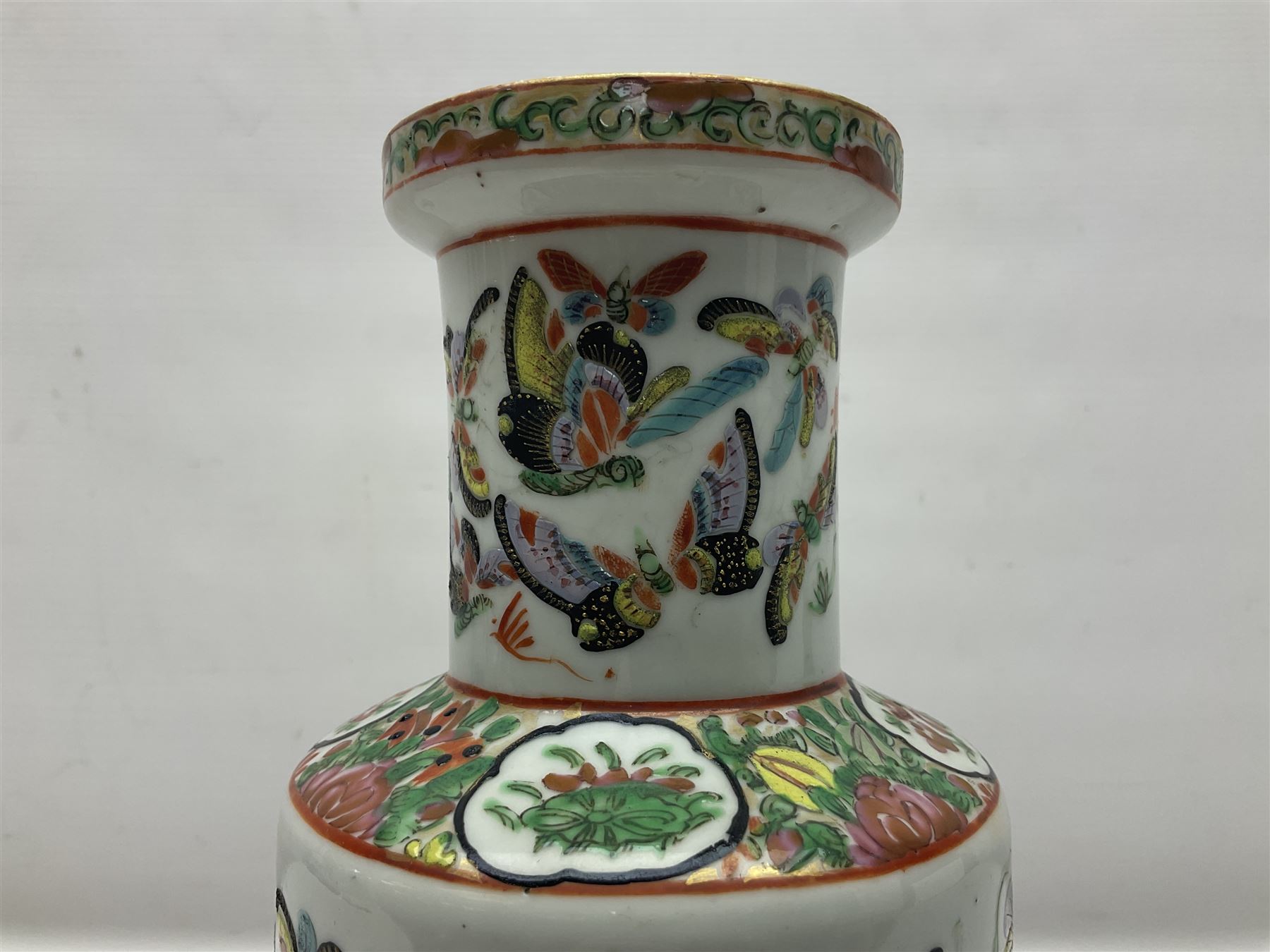 19th century Chinese Canton vase of slender baluster form, decorated with butterflies and floral panel to the neck, H30cm