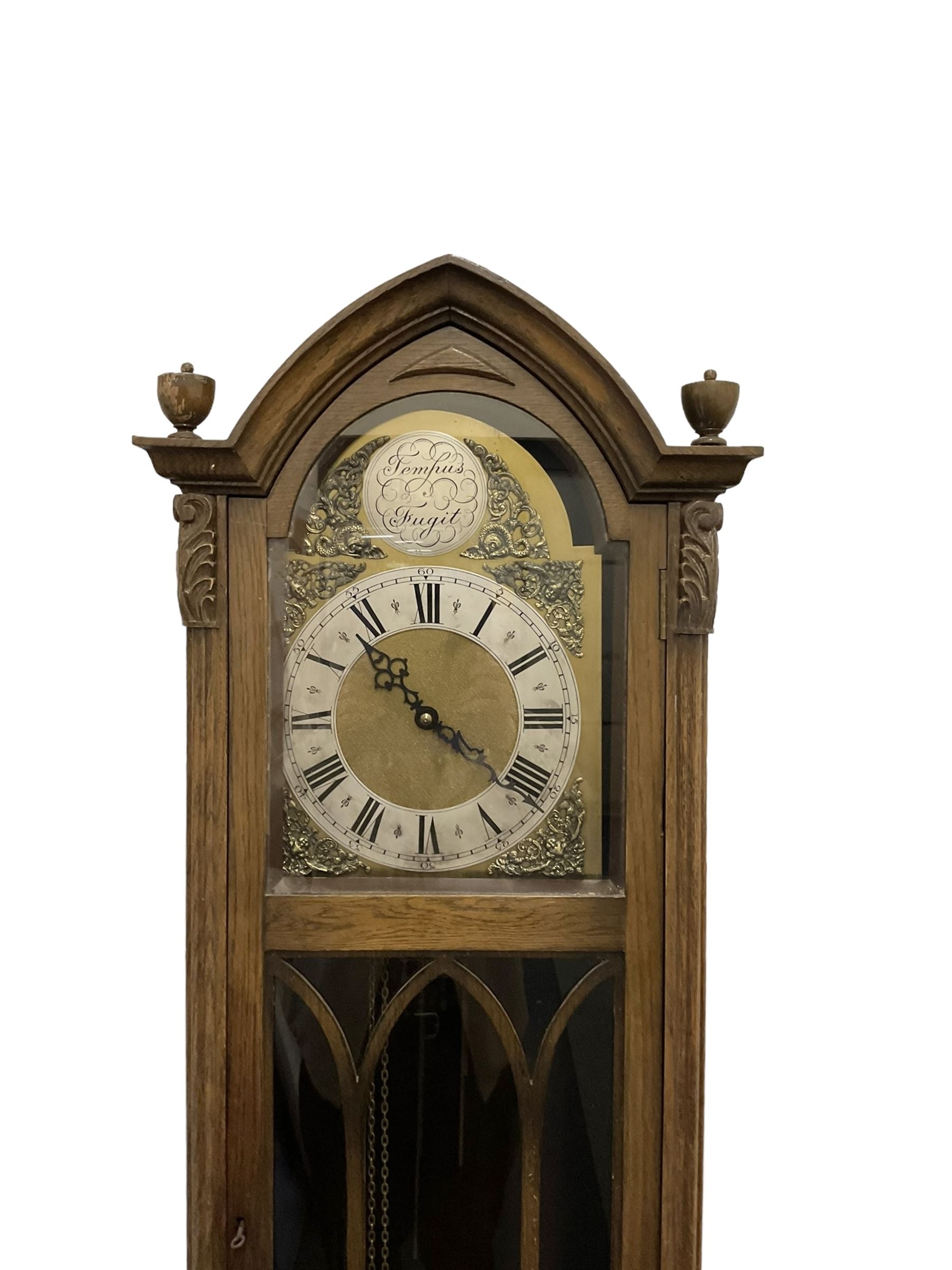 20th century granddaughter clock in an oak case.