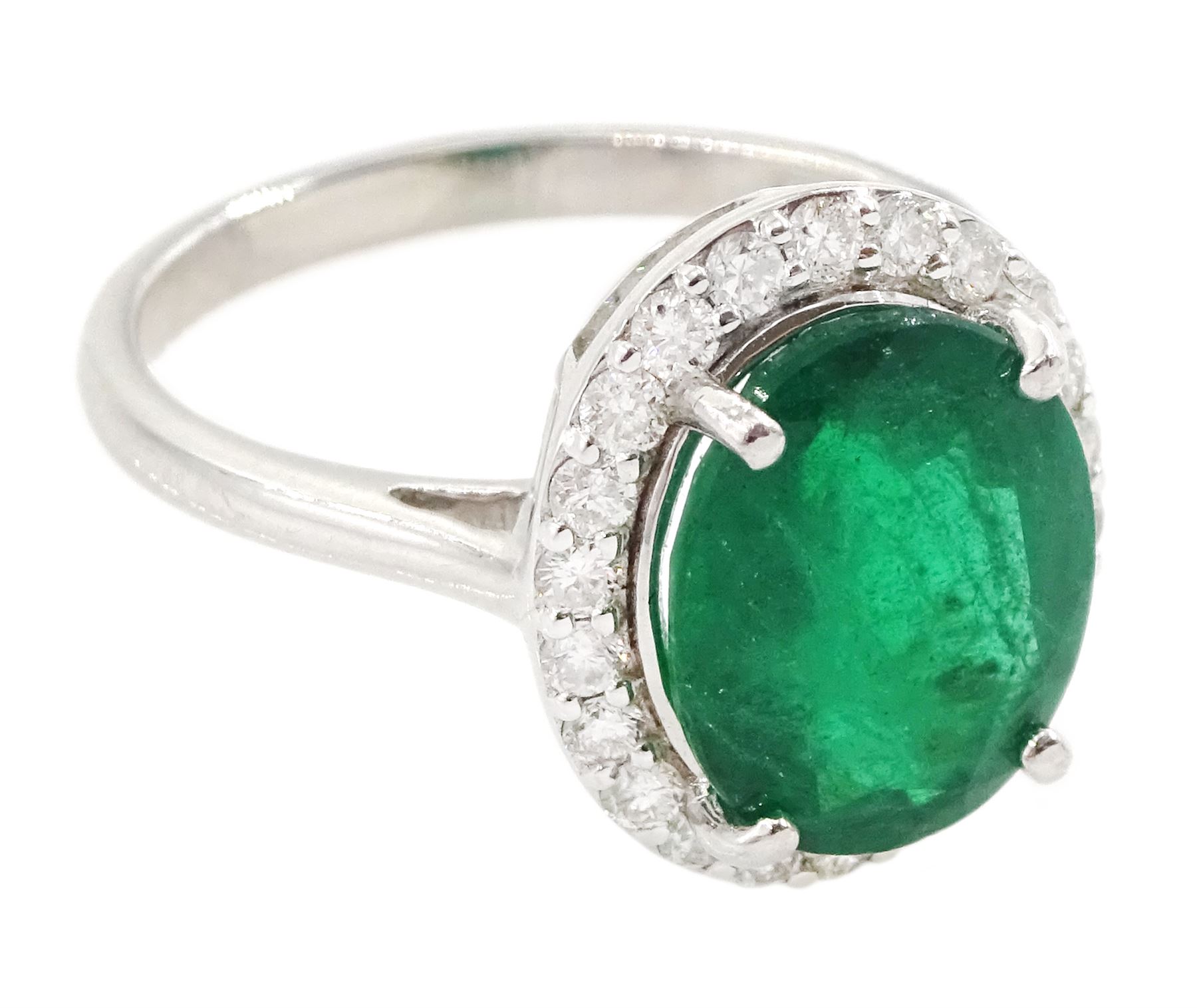 18ct white gold oval cut emerald and round brilliant cut diamond cluster ring, hallmarked, total emerald weight 3.33 carat, total diamond weight 0.40 carat, with World Gemological Institute Report