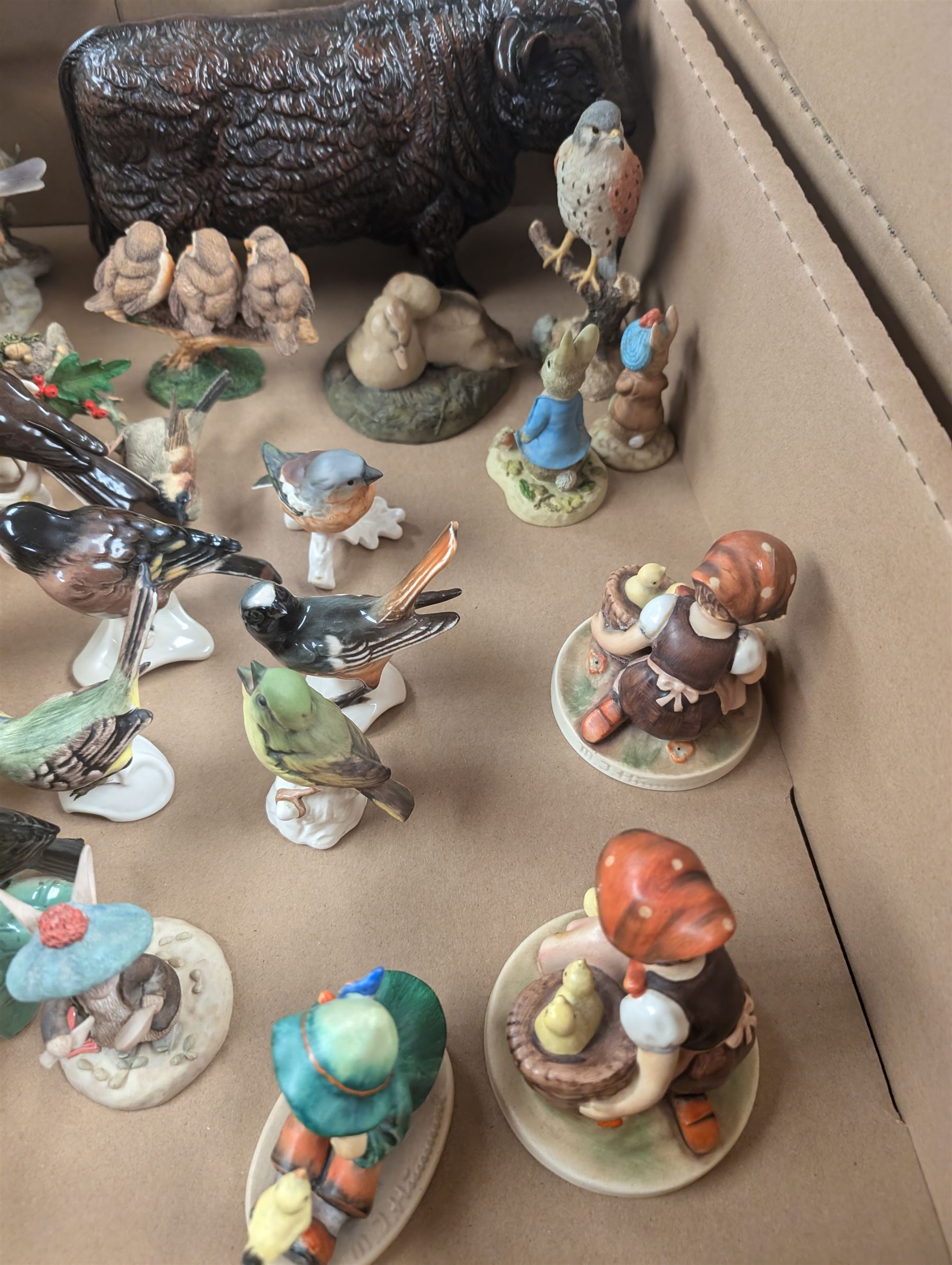 Collection of bird and animal figurines, including Goebel and Country Artists examples