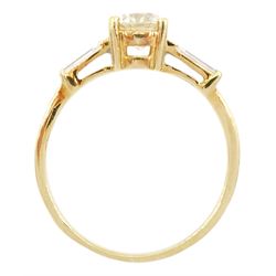 18ct gold single stone round brilliant cut diamond ring, with tapered baguette diamond shoulders, stamped 750, principal diamond approx 0.65 carat, total diamond weight approx 0.85 carat