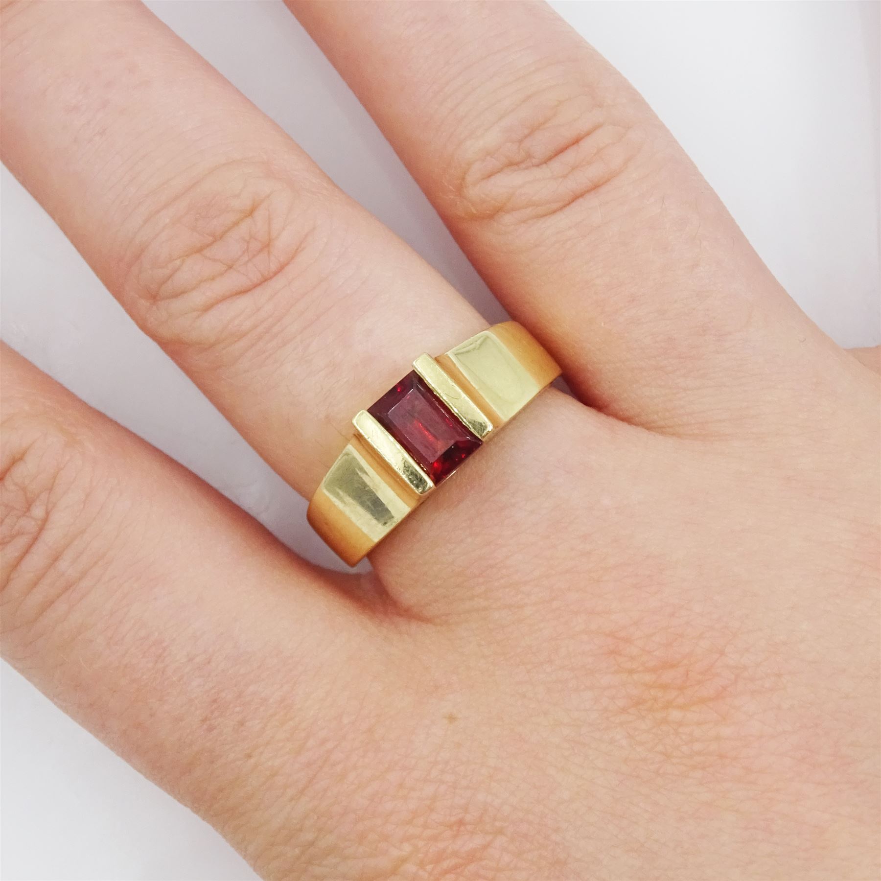 10ct gold single stone emerald cut garnet ring, stamped