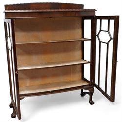 Early 20th century mahogany bow-front display cabinet, fitted with two astragal glazed doors enclosing two shelves, on cabriole supports with ball and claw feet