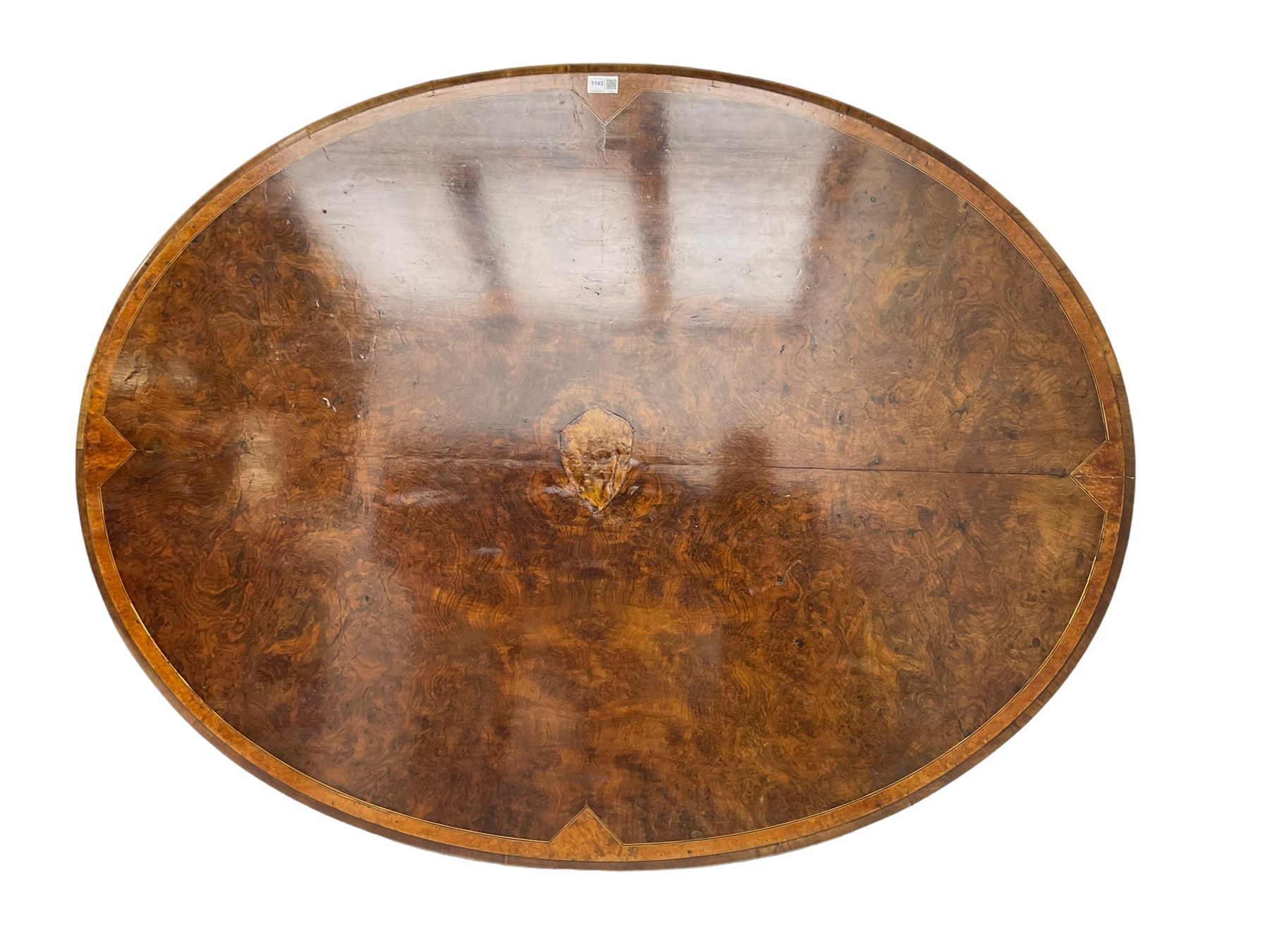 Victorian figured walnut loo table, oval moulded top with quarter matched veneers, on quadruple turned pillar base, acanthus carved splayed supports with scrolled terminals