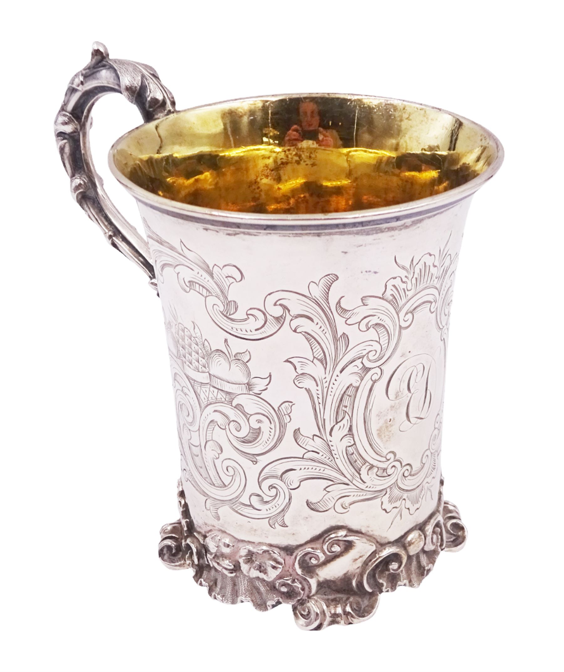 Victorian silver christening mug, of cylindrical form with fluted rim, gilt interior and acanthus capped C scroll handle, the body with later engraved decoration and initials, with embossed scroll base, hallmarked John Evans II, London 1840, including handle H10.2cm