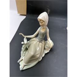 Four Lladro figures, including Girl with Lamb, Girl with Dove etc