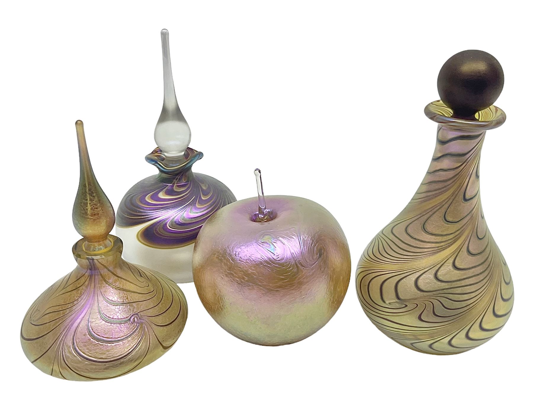 Four Okra scent bottles, the first example modelled as an apple, the second of squat form decorated with iridescent threads upon a gold ground and two others 