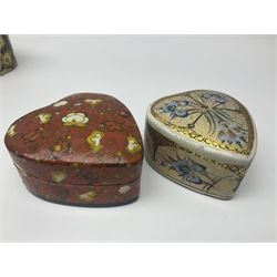 Nine lacquered boxes, including seven heart shaped examples, mainly decorated with floral designs, largest H12cm