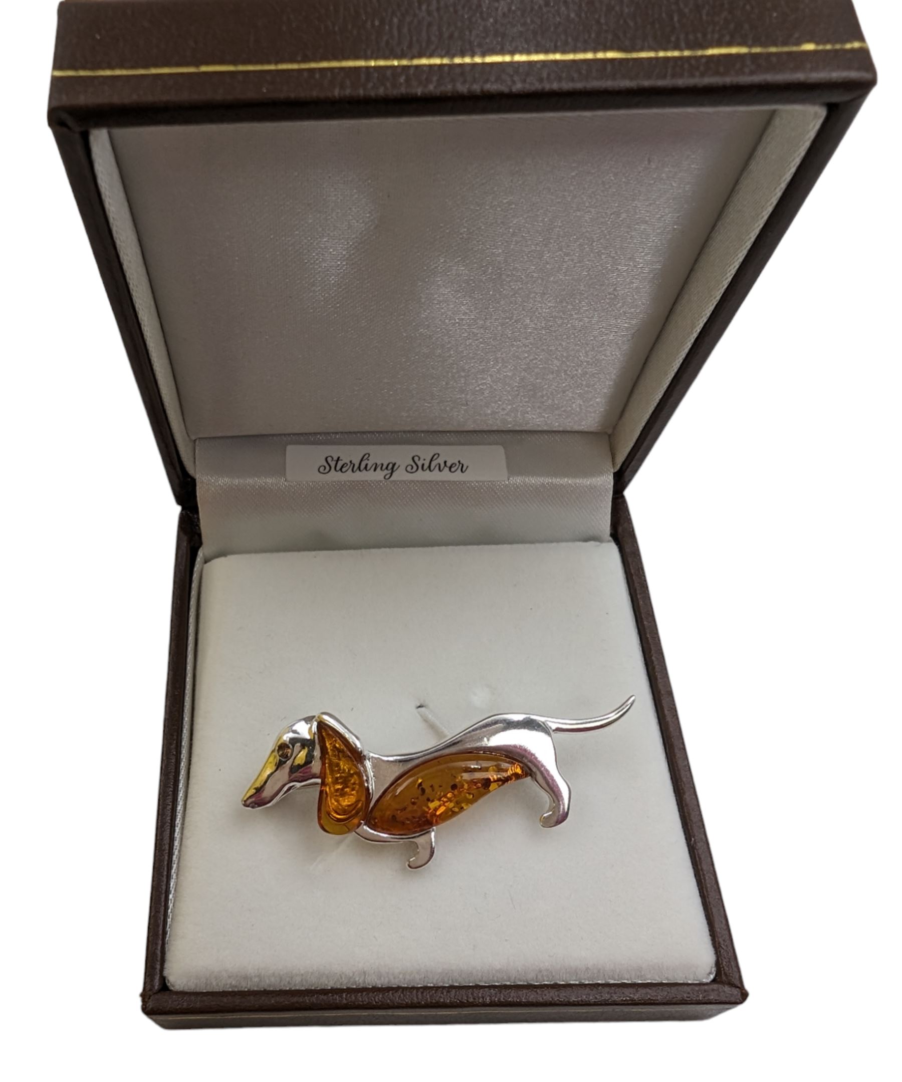 Silver Baltic amber dachshund brooch, stamped 925, boxed 