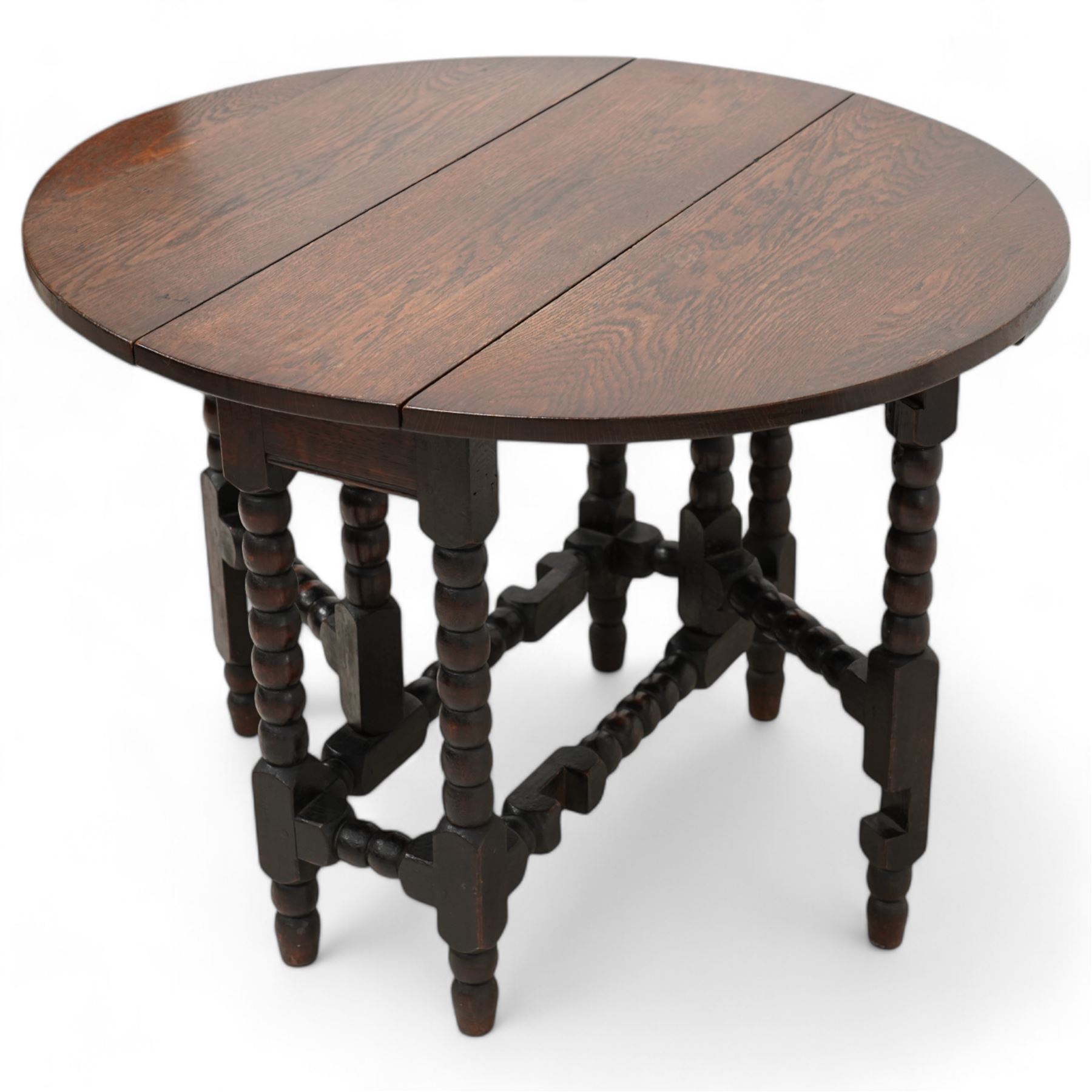 Small 17th century design oak drop-leaf, table oval top over bobbin-turned gate-leg supports, united by stretchers