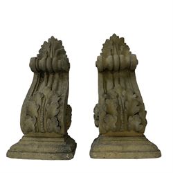 Pair of Victorian design cast stone architectural corbel wall brackets, stepped rectangular top over a scrolled bracket with relief acanthus leaf decoration and rosette motifs to the side