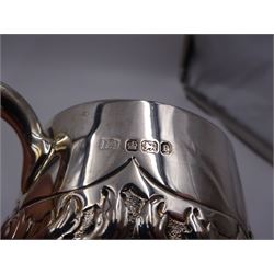 Late Victorian silver christening mug, with C handle and gilt interior, the body profusely embossed with floral and foliate decoration, hallmarked Atkin Brothers, Sheffield 1897, H10cm