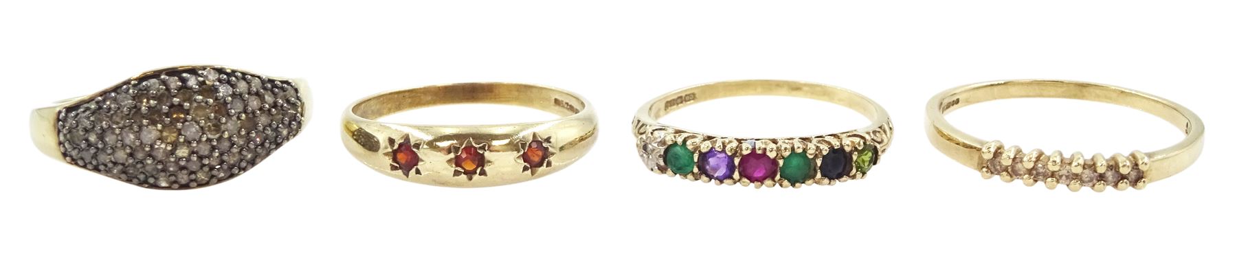 Four 9ct gold stone set rings including seven stone champagne diamond, garnet and multi gemstone set, three stone garnet ring and a diamond dome ring, all hallmarked