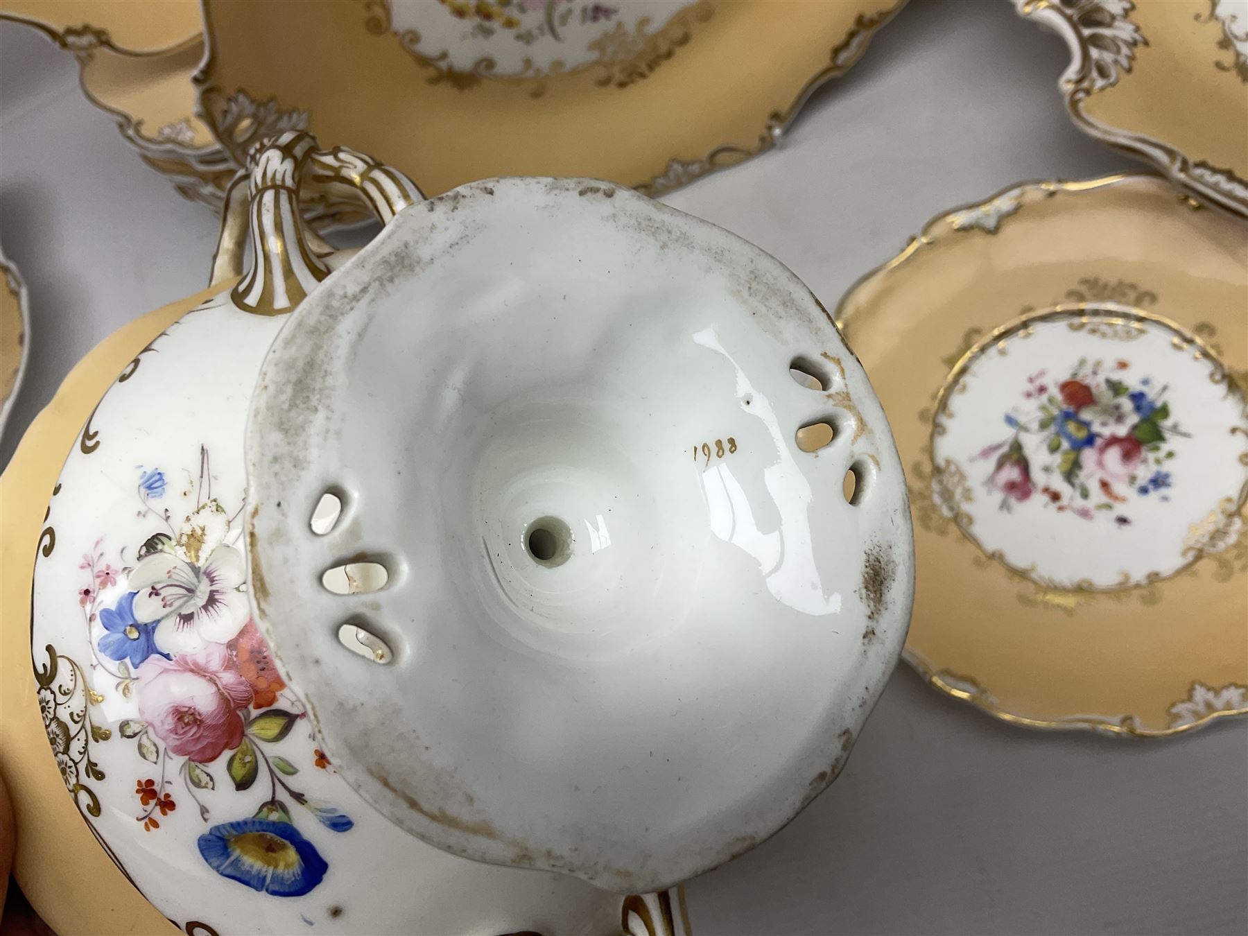 Victorian part dessert service, including eighteen plates, four small serving dishes, shallow dish, etc hand painted with floral sprigs within a cream border with floral panels, and heightened in gilt (26cm)