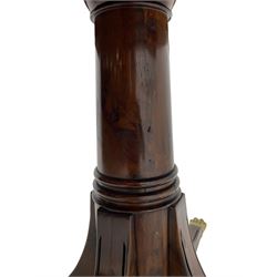 Georgian design inlaid chestnut wood centre table, the circular tilt-top inlaid with satinwood banding, gun barrel turned pedestal on four out-splayed supports, cast brass hairy paw castors, stamped 'P.H.R & Co. Holt, England' 