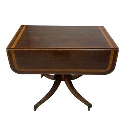 Early 19th century mahogany Pembroke table, rectangular drop-leaf top with rounded corners inlaid satinwood bands, single end drawer and opposing false drawer, turned pedestal on four acanthus carved and reed moulded splayed supports, cast brass cups and castors 