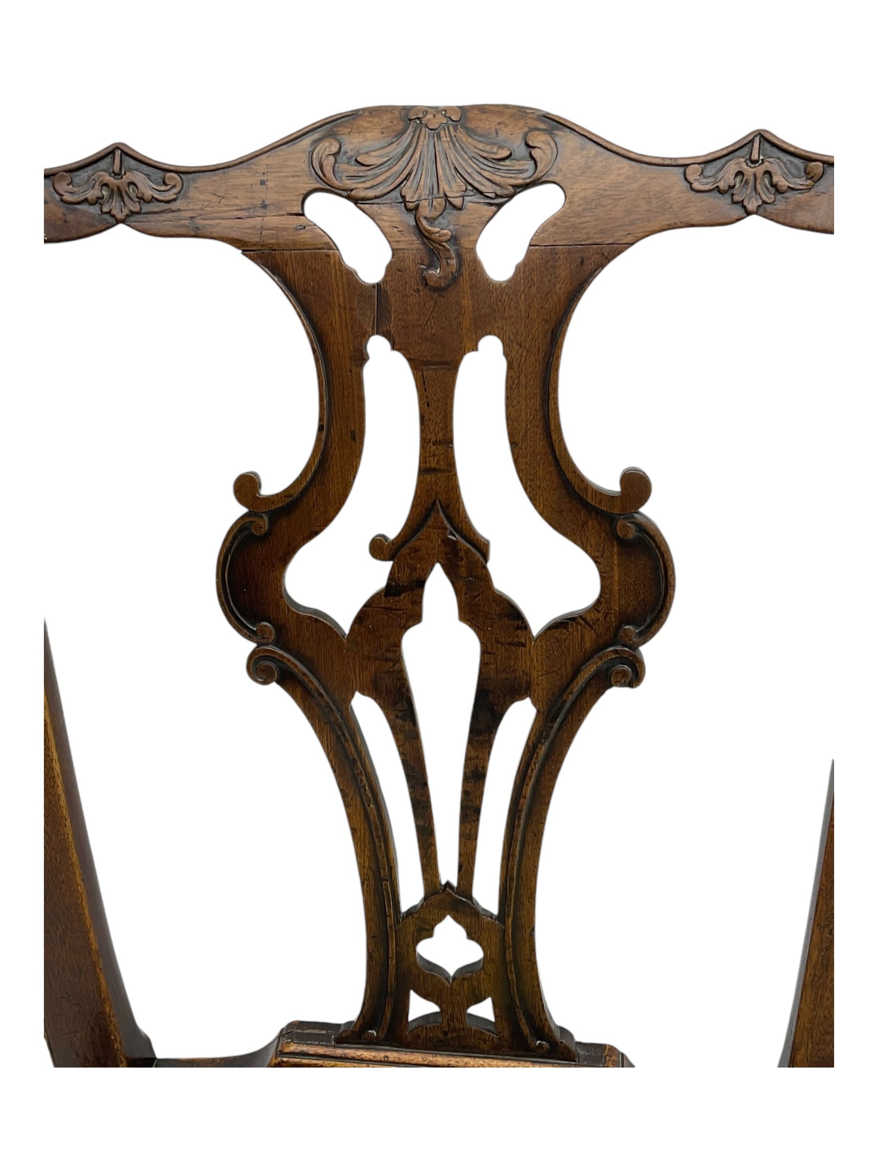 George III Chippendale design dining chair, shaped cresting rail carved with foliate scrolls over pierced and carved splat, floral needle-work upholstered drop-in seat, on square moulded supports united by H-stretchers 