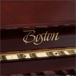 Boston - Upright overstrung piano in a lacquered mahogany case, designed by Steinway and manufactured by Kawai in Japan, Model 118E, serial No 131623 (1999), with 88 synthetic ivory/ ebony keys (seven octaves) with mute, una-corda and sustain pedals, original nickel plated tuning pins, hammers, strings and damper felts. With matching duet stool.