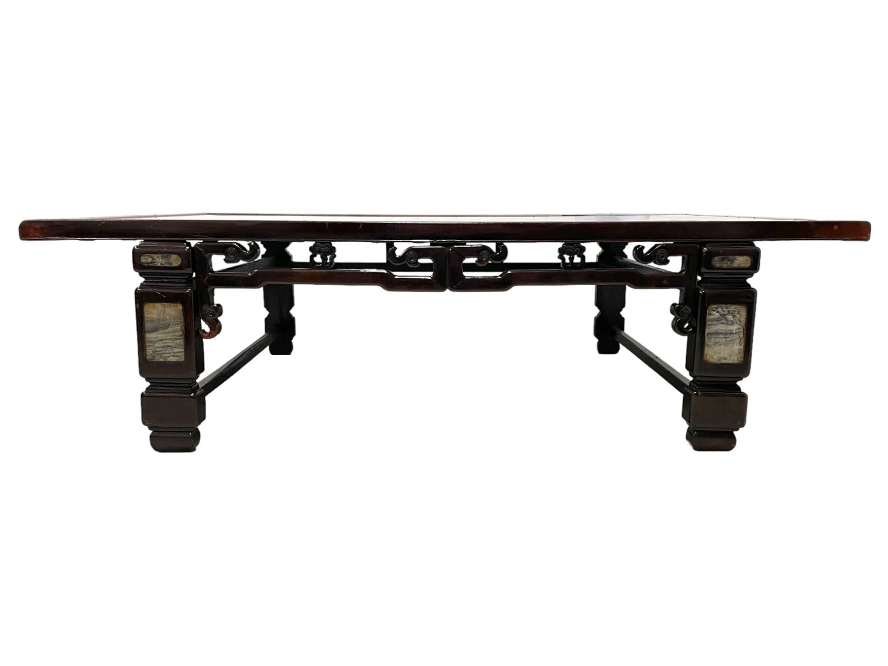 19th century Chinese stained hardwood coffee table, rectangular top with inset rattan surface and moulded slip, the pierced frieze carved with stylised clouds and floral motifs, the turned rectangular supports inlaid with 'dreamstone' type plaques, united by stretchers