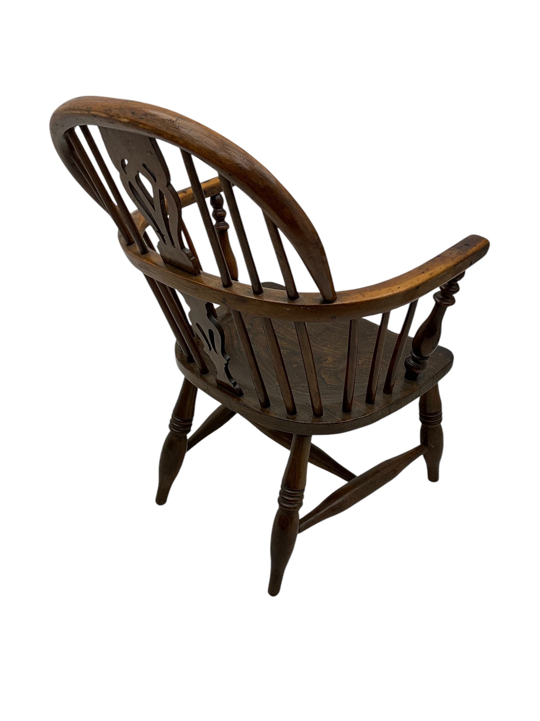 19th century elm and ash Windsor armchair, double hoop and stick back with shaped and pierced splat, on turned supports united by swell-turned H-stretchers (W60cm, H108cm); 19th century elm and yew wood Windsor chair (W57cm) (2)