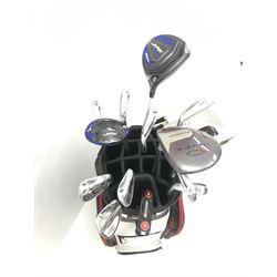 A quantity of TaylorMade golf clubs and others and two bags 