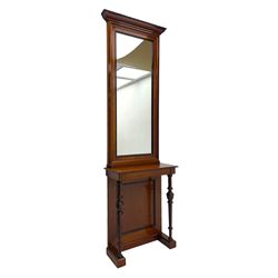 Late 19th to early 20th century walnut hallway console table with pier mirror, tall rectangular mirror with ovolo-moulded cornice, plain mirror plate surrounded by moulded slip and crossbanding, rectangular top over panelled back supports by turned supports, on sledge feet 