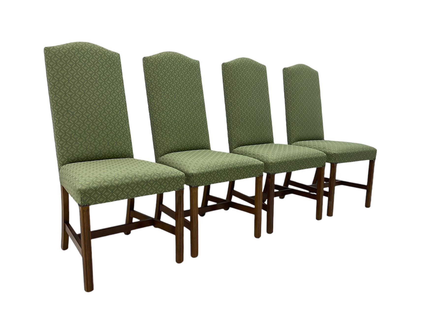 Early 20th century oak extending dining table, rectangular top with rounded corners, on turned baluster supports united by X-stretchers, fitted with a pull-out extending mechanism (106 x 142 - 228cm, H76cm); set of eight high-back dining chairs upholstered in green fabric with geometric diamond pattern