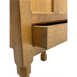 Mouseman - oak work or sewing box, rectangular adzed top inscribed 'L. M. C. 1976' enclosing vacant interior, triple panelled front and double panelled sides, fitted with single drawer, on octagonal supports, carved with mouse signature, by the workshop of Robert Thompson, Kilburn 